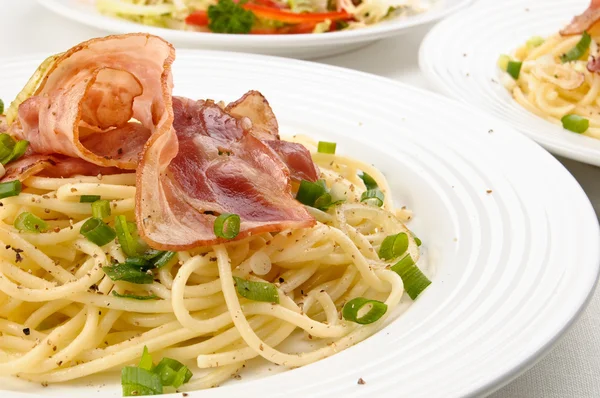 Pasta with bacon and chives — Stock Photo, Image