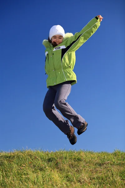 Beautiful girl jumping outdoor — Stock Photo, Image