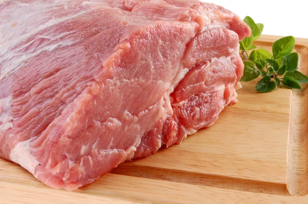 Raw pork on cutting board — Stock Photo, Image