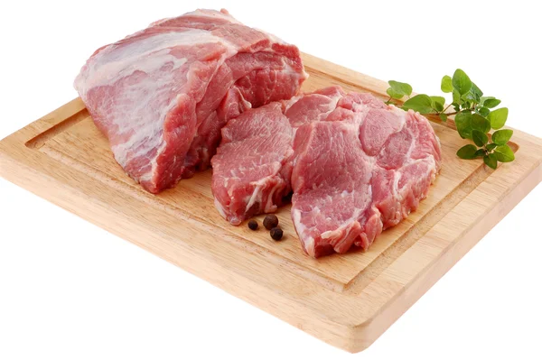 Raw pork on cutting board Royalty Free Stock Images