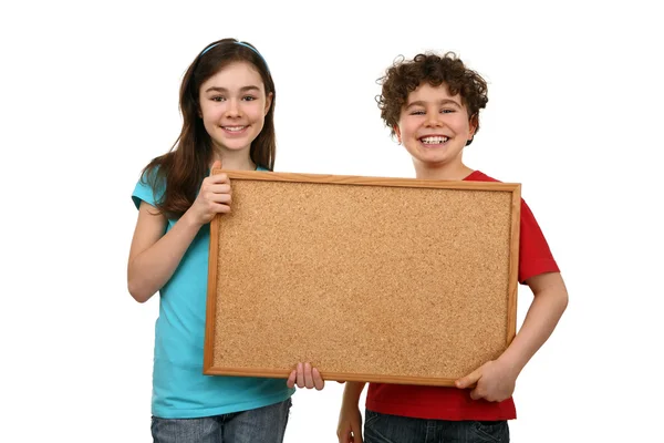 Kids holding noticeboard — Stock Photo, Image