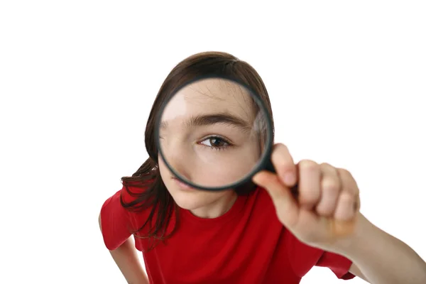 Girl holding magnifying glass — Stock Photo, Image