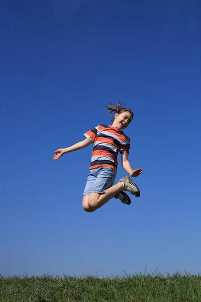 Boy playing outdoors — Stock Photo, Image