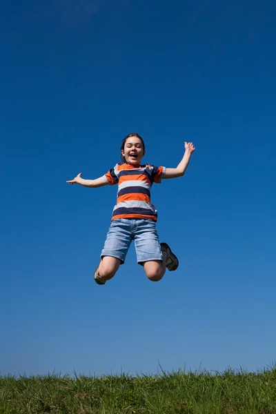 Girl jumping outdoor Stock Image