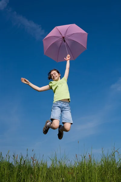 Girl jumping, flying with purple umbrella — Stock Photo, Image