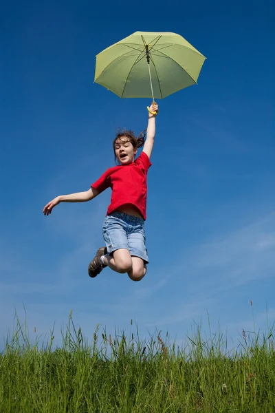 Girl jumping, flying with green umbrella — Stock Photo, Image