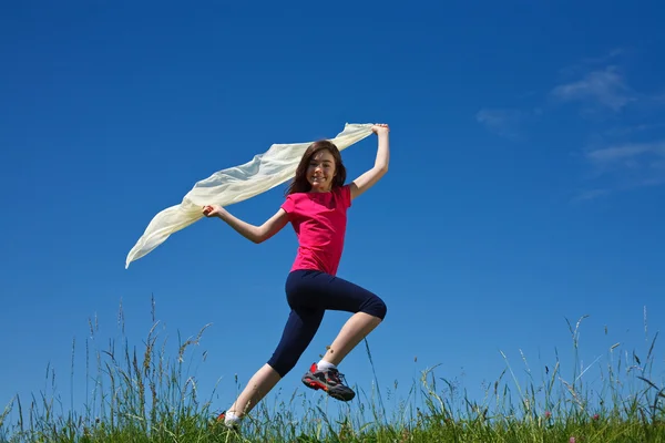Young girl jumping outdoor — Stock Photo, Image