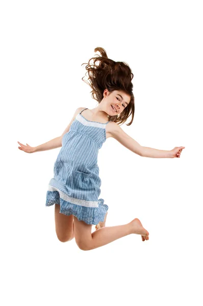 Tyttö hyppää — kuvapankkivalokuva