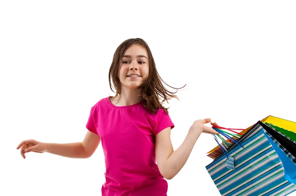 Junges Mädchen mit Einkaufstaschen — Stockfoto