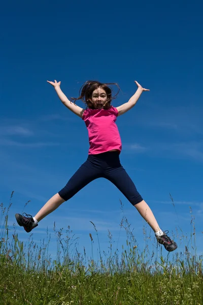 Girl running, jumping outdoors — Stock Photo, Image