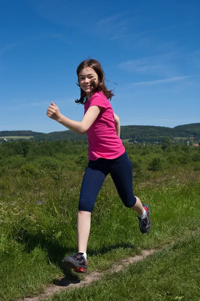 Girl running, jumping outdoors — Stock Photo, Image