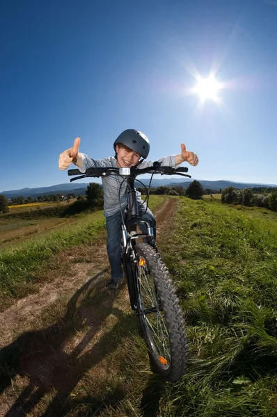 Young boy riding bike — Stock Photo, Image