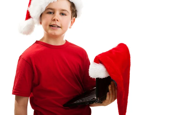 Jongen met kerstman hoed met laptop — Stockfoto