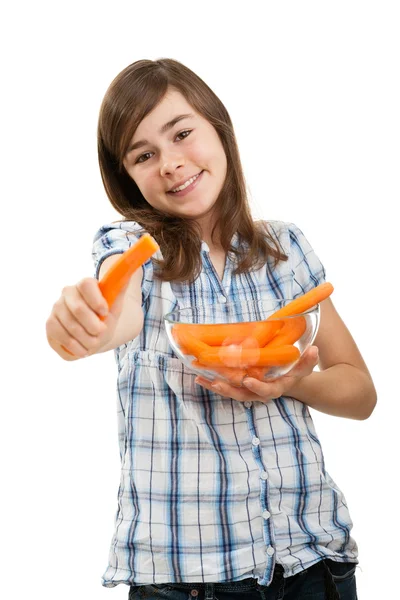 Girl eating fresh carrots — Stock Photo, Image