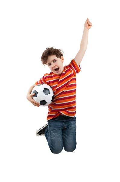 Boy jumping with fotball ball — Stock Photo, Image