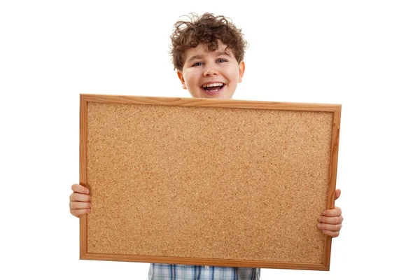 Niño sosteniendo tablón de anuncios en blanco — Foto de Stock