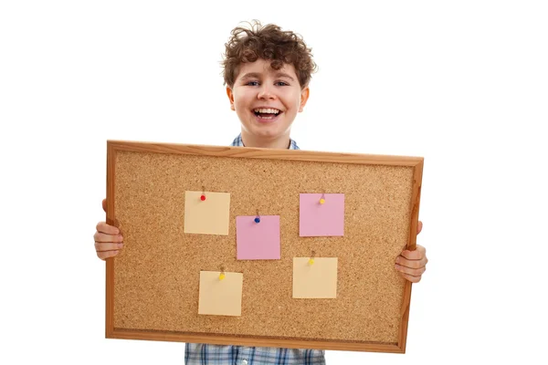 Young boy holding blank noticeboard — Stock Photo, Image