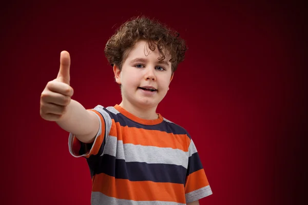 Jongen met Duimschroef opwaarts — Stockfoto