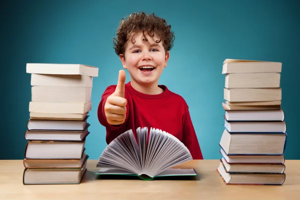 Curly boy learning at home — Stock Photo, Image