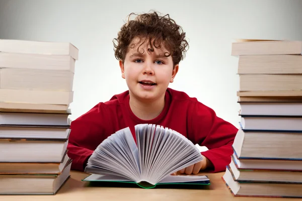 Curly boy learning at home — Stock Photo, Image