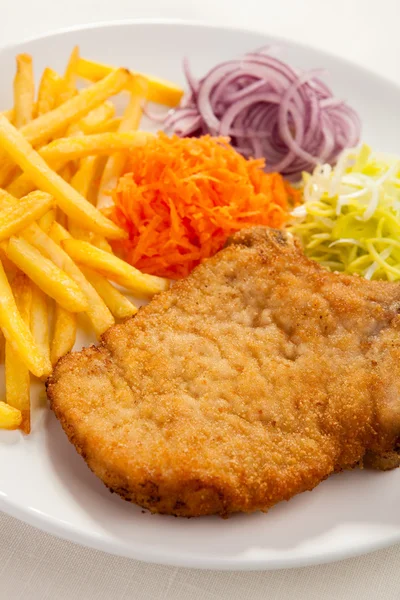 Fried chop pork, french fries and vegetable salad — Stock Photo, Image