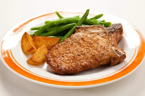 Grilled steak with chips and beans — Stock Photo, Image
