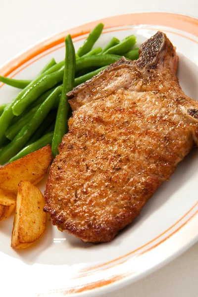 Grilled steak with chips and beans — Stock Photo, Image