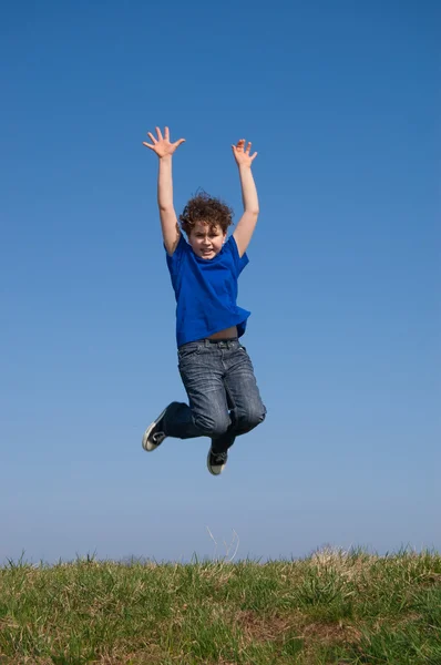 Boy jumping outdoor — Stock Photo, Image
