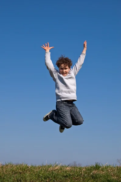 Boy jumping outdoor — Stock Photo, Image