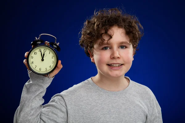 Young boy with alarm clock — Stock Photo, Image