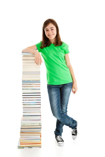 Estudiante de pie cerca de los libros — Foto de Stock