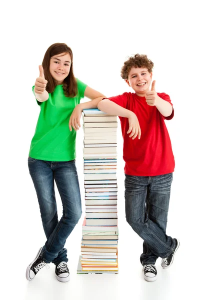 Students standing close to pile — Stock Photo, Image