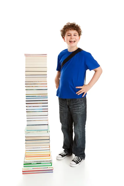 Estudiante cerca de la pila de libros — Foto de Stock