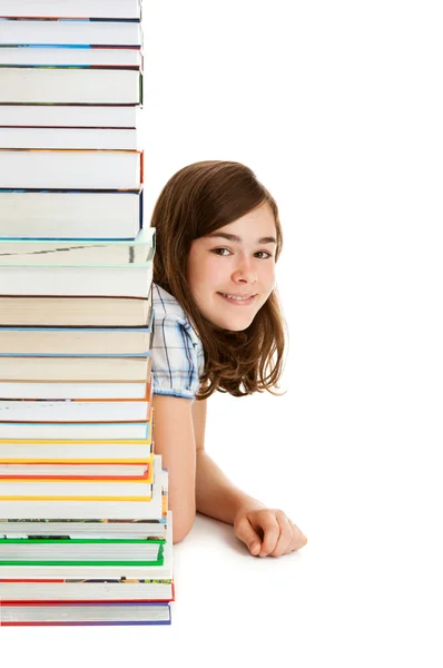 Menina por trás pilha de livros — Fotografia de Stock