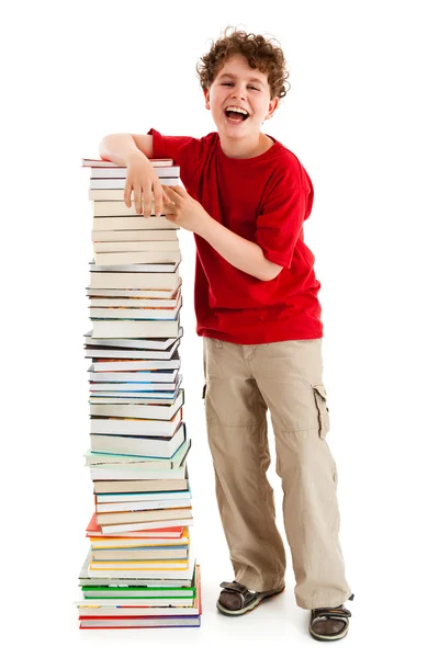 Studente in piedi vicino alla pila di libri — Foto Stock