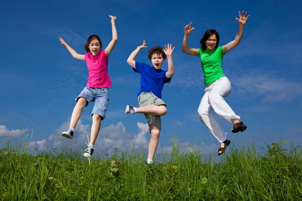 Family jumping, running outdoor — Stock Photo, Image