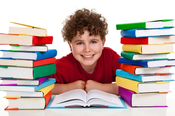 Estudiante con pila de libros — Foto de Stock