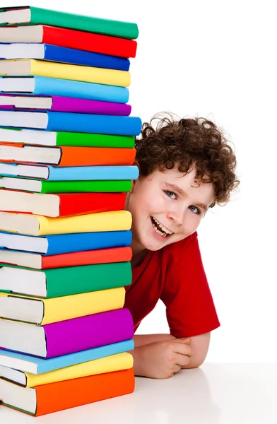 Estudante com pilha de livros — Fotografia de Stock
