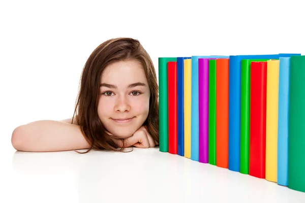Diák halom könyvet ül — Stock Fotó