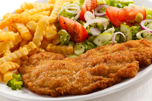 Fried pork, chop French fries and vegetables — Stock Photo, Image