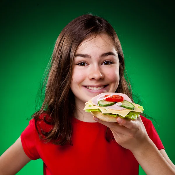 Girl eating healthy sandwich — Stock Photo, Image