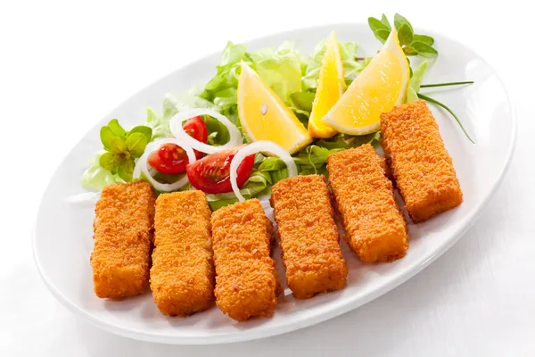 Fried fish fingers and vegetables Stock Photo