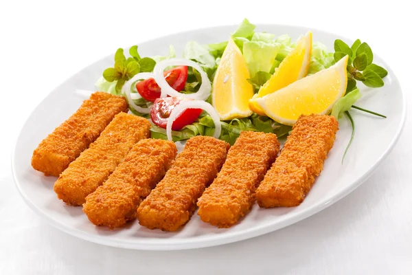 Fried fish fingers and vegetables Stock Image