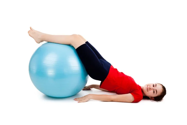 Girl exercising using ball Royalty Free Stock Images