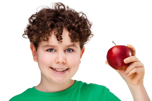 Niño comiendo manzana roja — Foto de Stock