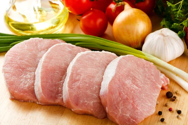 Raw pork on cutting board — Stock Photo, Image