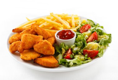 Fried chicken nuggets, French fries and vegetables clipart