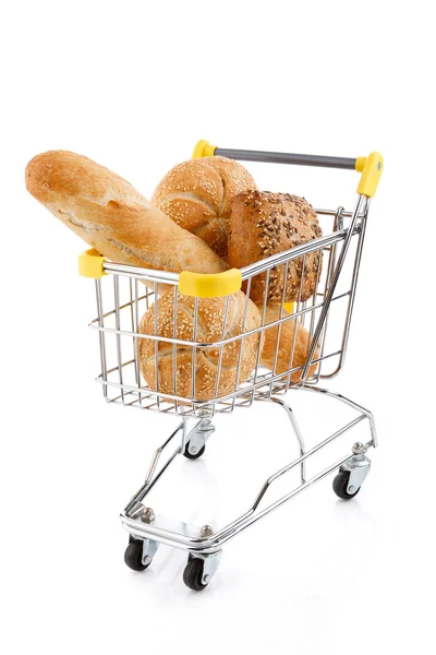 Shopping trolley full of bread and rolls — Stock fotografie