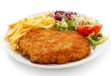 Fried pork chop French fries and vegetables clipart