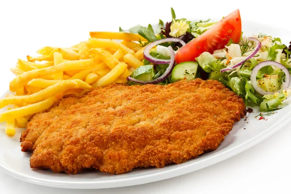 Fried pork chop, French fries and vegetables — Stock Photo, Image